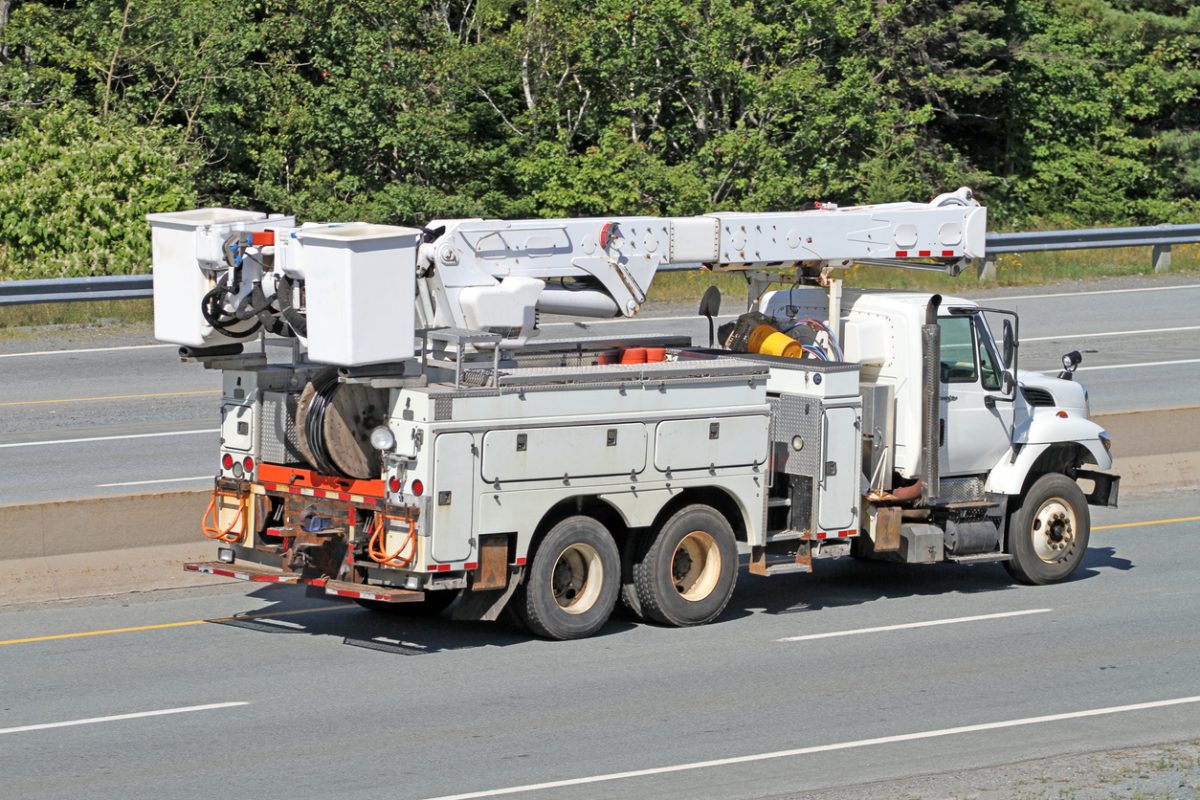 Side View Of A Hydro Utility Truck On A Highway
